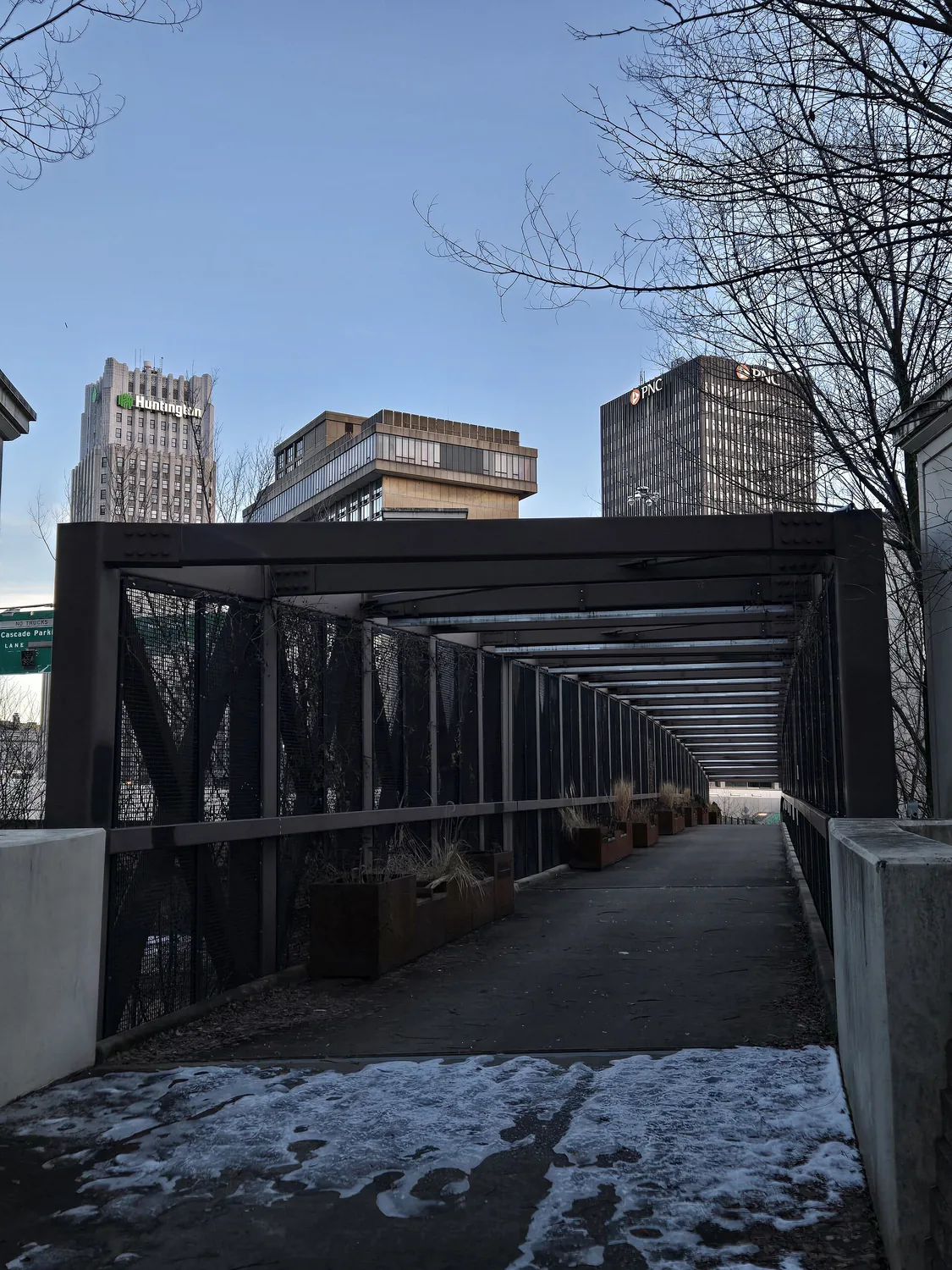The Towpath Trail footbridge over the Ohio & Erie Canal, with the Akron
             skyline beyond it